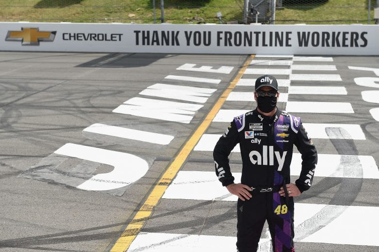 LONG POND, PENNSYLVANIA - JUNE 28: Jimmie Johnson, driver of the #48 Ally Chevrolet, poses on the Start/Finish line to show support for front line workers prior to the NASCAR Cup Series Pocono 350 at Pocono Raceway on June 28, 2020 in Long Pond, Pennsylvania. (Photo by Jared C. Tilton/Getty Images) | Getty Images