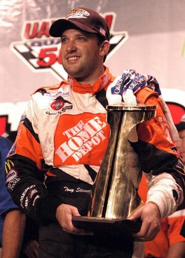 CONCORD, NC - OCTOBER: Tony Stewart, driver of the #20 Gibbs Racing Chevrolet, wins the UAW-GM 500, on October 11, 2003 at Lowes Motor Speedway in Concord, North Carolina. (Photo By Rusty Jarrett/Getty Images) | Getty Images
