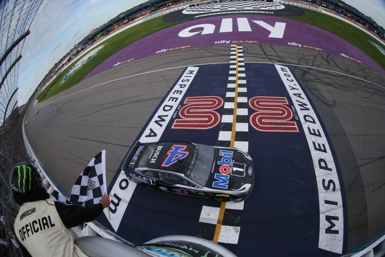 BROOKLYN, MICHIGAN - AUGUST 11: Kevin Harvick, driver of the #4 Mobil 1 Ford, takes the checkered flag to win the Monster Energy NASCAR Cup Series Consumers Energy 400 at Michigan International Speedway on August 11, 2019 in Brooklyn, Michigan. (Photo by Matt Sullivan/Getty Images) | Getty Images