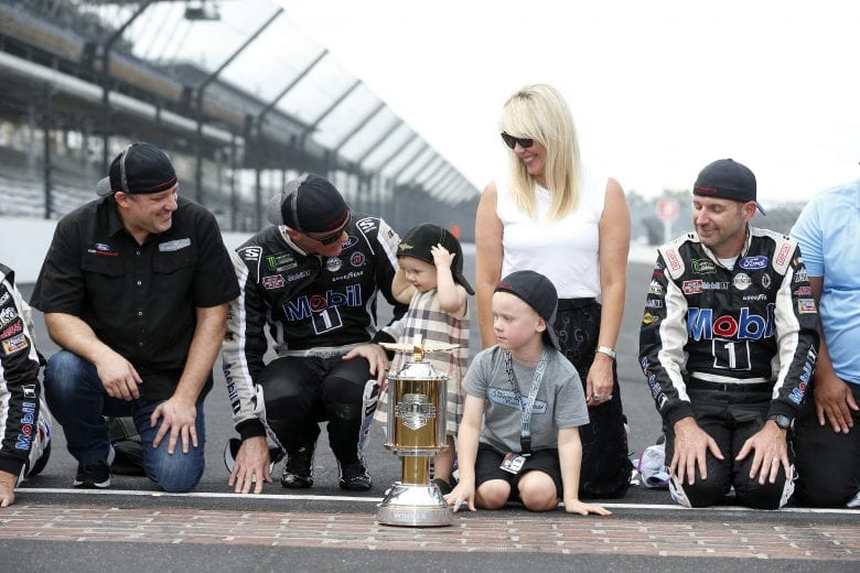 INDIANAPOLIS, INDIANA - SEPTEMBER 08: Kevin Harvick, driver of the #4 Mobil 1 Ford, celebrates after winning the Monster Energy NASCAR Cup Series Big Machine Vodka 400 at the Brickyard at Indianapolis Motor Speedway on September 08, 2019 in Indianapolis, Indiana. (Photo by Brian Lawdermilk/Getty Images) | Getty Images