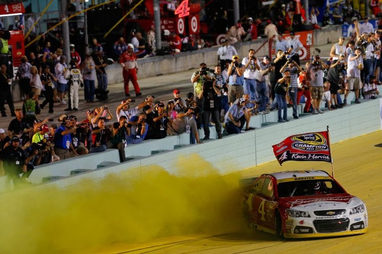 HOMESTEAD, FL - NOVEMBER 16:  Kevin Harvick, driver of the #4 Budweiser Chevrolet, celebrates with a burnout after winning the NASCAR Sprint Cup Series Ford EcoBoost 400 at Homestead-Miami Speedway on November 16, 2014 in Homestead, Florida.  (Photo by Chris Trotman/NASCAR via Getty Images)