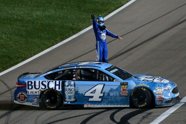 KANSAS CITY, KS - MAY 12:  Kevin Harvick, driver of the #4 Busch Light Ford, celebrates after winning the Monster Energy NASCAR Cup Series KC Masterpiece 400 at Kansas Speedway on May 12, 2018 in Kansas City, Kansas.  (Photo by Sean Gardner/Getty Images) | Getty Images