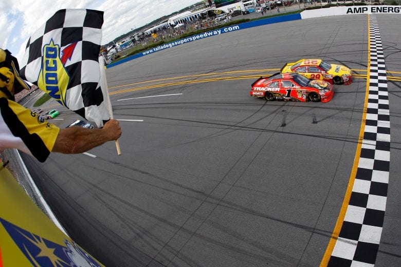 TALLADEGA, AL - APRIL 25:  Kevin Harvick, driver of the #29 Shell/Pennzoil Chevrolet, crosses the finish line ahead of Jamie McMurray, driver of the #1 Bass Pro Shops Chevrolet, to win the NASCAR Sprint Cup Series Aaron's 499 at Talladega Superspeedway on April 25, 2010 in Talladega, Alabama.  (Photo by Todd Warshaw/Getty Images) | Getty Images