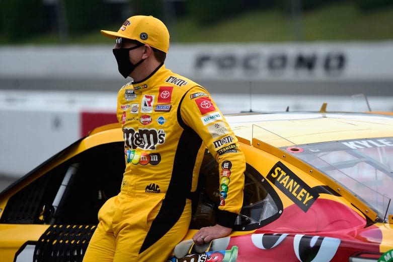 LONG POND, PENNSYLVANIA - JUNE 28: Kyle Busch, driver of the #18 M&M's Mini's Toyota, stands on the grid prior to the NASCAR Cup Series Pocono 350 at Pocono Raceway on June 28, 2020 in Long Pond, Pennsylvania. (Photo by Jared C. Tilton/Getty Images) | Getty Images