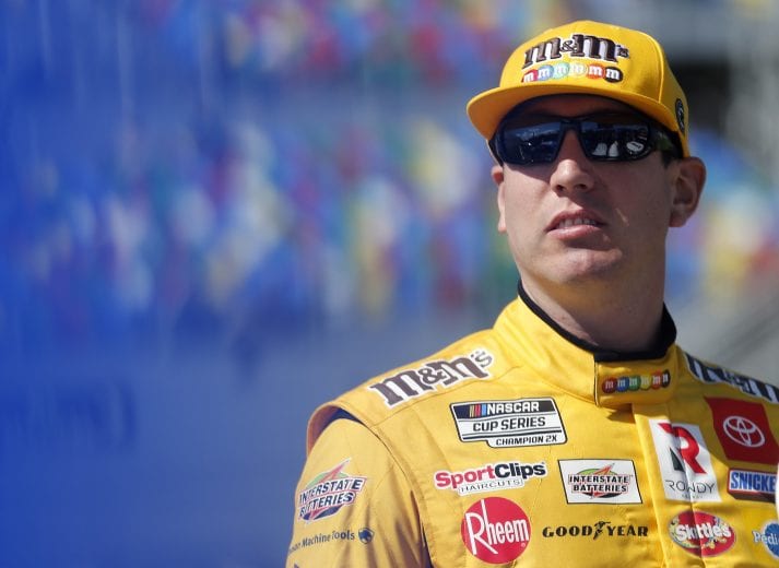 DAYTONA BEACH, FLORIDA - FEBRUARY 09: Kyle Busch, driver of the #18 M&M's Toyota, stands on the grid during qualifying for the NASCAR Cup Series 62nd Annual Daytona 500 at Daytona International Speedway on February 09, 2020 in Daytona Beach, Florida. (Photo by Brian Lawdermilk/Getty Images) | Getty Images