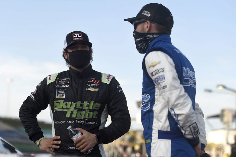 SPARTA, KENTUCKY - JULY 09: Jesse Little, driver of the #4 TeamJDMotorsports.com Chevrolet, and Ross Chastain, driver of the #10 Chevy Accessories Chevrolet, talk on the grid prior to the NASCAR Xfinity Series Shady Rays 200 at Kentucky Speedway on July 09, 2020 in Sparta, Kentucky. (Photo by Jared C. Tilton/Getty Images) | Getty Images