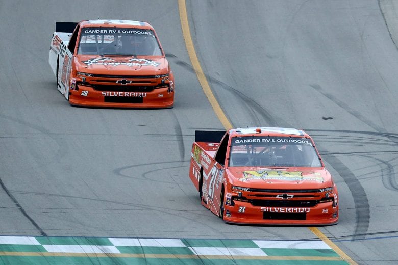 SPARTA, KENTUCKY - JULY 11: Zane Smith, driver of the #21 LaPaz Margarita Mix Chevrolet, races Brett Moffitt, driver of the #23 Chevrolet, during the NASCAR Gander RV & Outdoors Truck Series Buckle Up In Your Truck 225 at Kentucky Speedway on July 11, 2020 in Sparta, Kentucky. (Photo by Rob Carr/Getty Images) | Getty Images