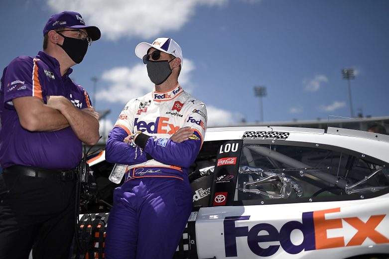 SPARTA, KENTUCKY - JULY 12: Denny Hamlin, driver of the #11 FedEx Freight Toyota, and crew chief Christopher Gabehart the NASCAR Cup Series Quaker State 400 Presented by Walmart at Kentucky Speedway on July 12, 2020 in Sparta, Kentucky. (Photo by Jared C. Tilton/Getty Images) | Getty Images