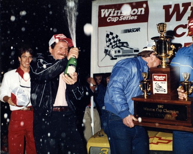 HAMPTON, GA — November 22, 1987:  Dale Earnhardt sprays champagne in victory lane at Atlanta International Raceway after being crowned the NASCAR Cup champion following his second place finish in the Atlanta Journal 500.  (Photo by ISC Images & Archives via Getty Images)
