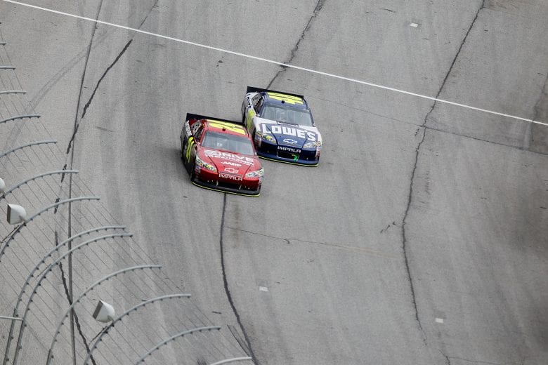 HAMPTON, GA - SEPTEMBER 06:  Jeff Gordon, driver of the #24 Drive to End Hunger Chevrolet, races Jimmie Johnson, driver of the #48 Lowe's Chevrolet, during the NASCAR Sprint Cup Series AdvoCare 500 at Atlanta Motor Speedway on September 6, 2011 in Hampton, Georgia.  (Photo by Kevin C. Cox/Getty Images) | Getty Images