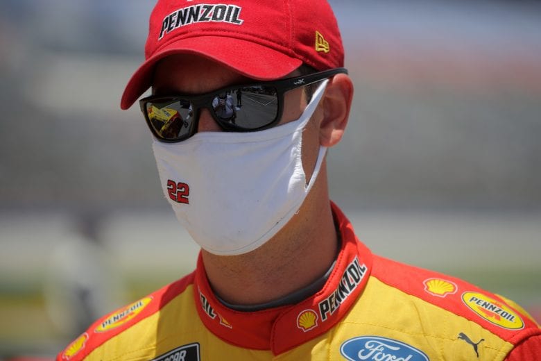 FORT WORTH, TEXAS - JULY 19: Joey Logano, driver of the #22 Shell Pennzoil Ford, walks on the grid prior to the NASCAR Cup Series O'Reilly Auto Parts 500 at Texas Motor Speedway on July 19, 2020 in Fort Worth, Texas. (Photo by Chris Graythen/Getty Images) | Getty Images