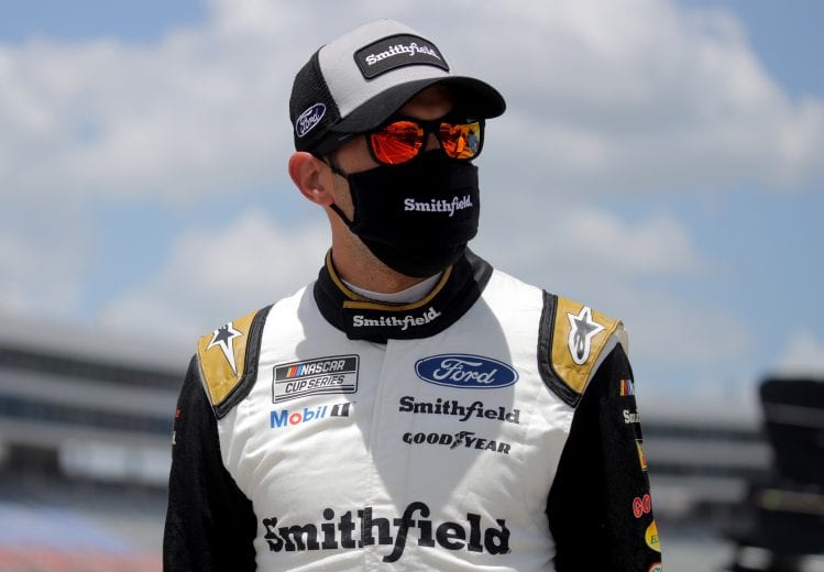 FORT WORTH, TEXAS - JULY 19: Aric Almirola, driver of the #10 Smithfield Hometown Original Ford, walks on the grid prior to the NASCAR Cup Series O'Reilly Auto Parts 500 at Texas Motor Speedway on July 19, 2020 in Fort Worth, Texas. (Photo by Chris Graythen/Getty Images) | Getty Images