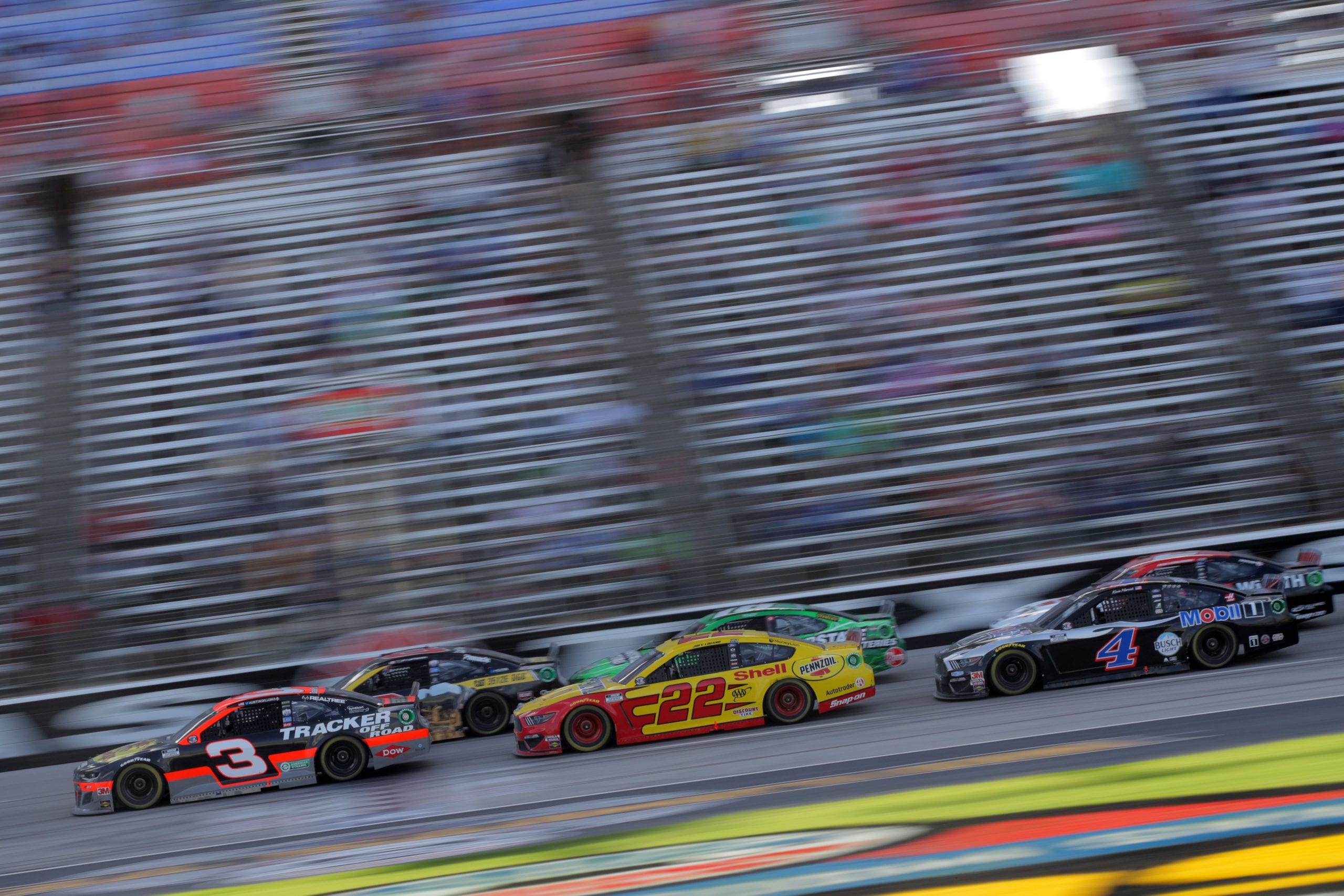 FORT WORTH, TEXAS - JULY 19: Austin Dillon, driver of the #3 Bass Pro Shops Chevrolet, and Tyler Reddick, driver of the #8 Cat Oil & Gas Chevrolet, lead the field during the NASCAR Cup Series O'Reilly Auto Parts 500 at Texas Motor Speedway on July 19, 2020 in Fort Worth, Texas. (Photo by Chris Graythen/Getty Images) | Getty Images