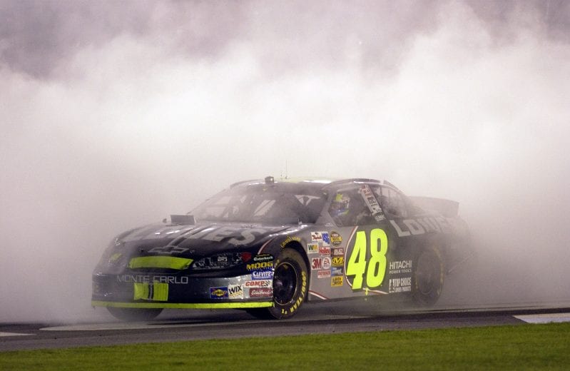 C0NCORD, NC - OCTOBER 16: Jimmie Johnson, driver of the #48 Lowes Chevrolet, celebrates winning,  the NASCAR Nextel Cup Series UAW-GM Quality 500 on October 16, 2004 at Lowes Motor Speedway in Concord, North Carolina.  (Photo by Rusty Jarrett/Getty Images) | Getty Images
