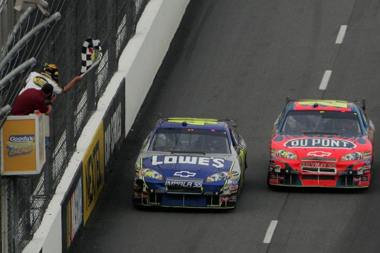 MARTINSVILLE, VA - APRIL 01:  Jimmie Johnson, driver of the #48 Lowe's Chevrolet, leads Jeff Gordon, driver of the #24 DuPont Chevrolet, to the checkered flag to win the NASCAR Nextel Cup Series Goody's Cool Orange 500 at Martinsville Speedway on April 1, 2007 in Martinsville, Virginia.  (Photo by Chris McGrath/Getty Images) | Getty Images