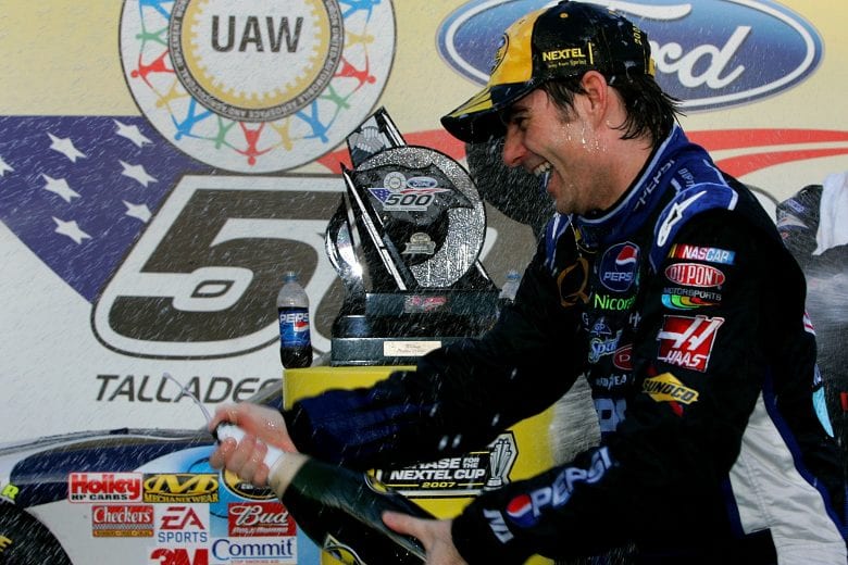 TALLADEGA, AL - OCTOBER 07:  Jeff Gordon, driver of the #24 Dupont/Pepsi Chevrolet, celebrates with his crew members in victory lane after winning the NASCAR Nextel Cup Series UAW-Ford 500 at Talladega Superspeedway on October 7, 2007 in Talladega, Alabama.  (Photo by Jason Smith/Getty Images for NASCAR) | Getty Images