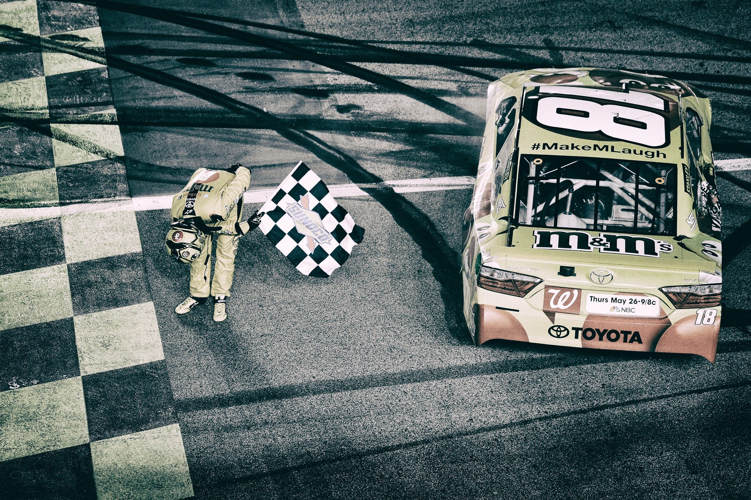KANSAS CITY, KS - MAY 07: (EDITOR'S NOTE: Image was processed using digital filters.)  Kyle Busch, driver of the #18 M&M's Red Nose Toyocta, celebrates after winning the NASCAR Sprint Cup Series Go Bowling 400 at Kansas Speedway on May 7, 2016 in Kansas City, Kansas.  (Photo by Robert Laberge/NASCAR via Getty Images)