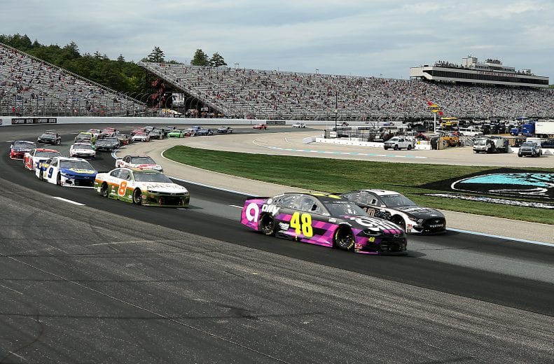 LOUDON, NEW HAMPSHIRE - AUGUST 02: Jimmie Johnson, driver of the #48 Ally Chevrolet, and Aric Almirola, driver of the #10 Smithfield Hometown Original Ford, lead the field during the NASCAR Cup Series Foxwoods Resort Casino 301 at New Hampshire Motor Speedway on August 02, 2020 in Loudon, New Hampshire. (Photo by Maddie Meyer/Getty Images) | Getty Images