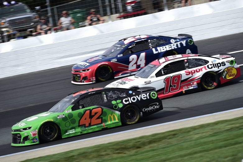 LOUDON, NEW HAMPSHIRE - AUGUST 02: Martin Truex Jr., driver of the #19 Sport Clips Toyota, races Matt Kenseth, driver of the #42 Clover Chevrolet, and William Byron, driver of the #24 Liberty University Chevrolet, during the NASCAR Cup Series Foxwoods Resort Casino 301 at New Hampshire Motor Speedway on August 02, 2020 in Loudon, New Hampshire. (Photo by Jared C. Tilton/Getty Images) | Getty Images
