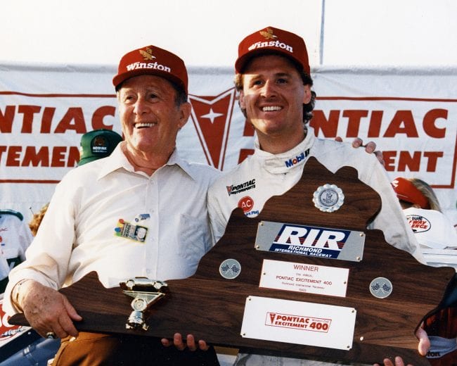 RICHMOND, VA — March 26, 1989: Track owner Paul Sawyer (L) with driver Rusty Wallace (R) in victory lane after Wallace won the Pontiac Excitement 400 NASCAR Cup race at Sawyer’s Richmond International Raceway. (Photo by ISC Images & Archives via Getty Images)
