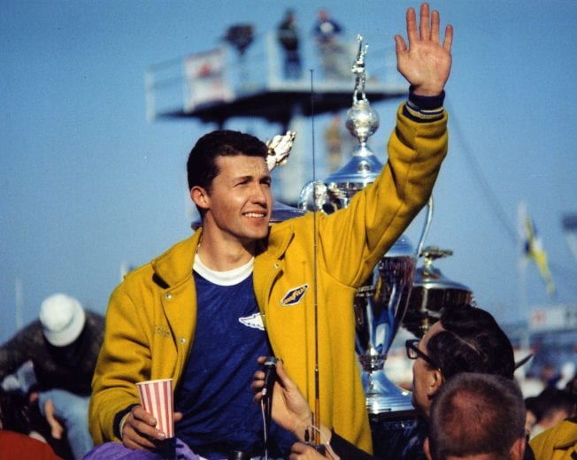 DAYTONA BEACH, FL - FEBRUARY 23: Richard Petty waves to the crowd after leading a 1-2-3 sweep by Plymouths in the Daytona 500, thrilling a sold out crowd of almost 70,000 on February 23, 1964 in Daytona Beach, Florida. Petty led all but 16 laps, defeating Jimmy Pardue and Paul Goldsmith for his first superspeedway victory. (Photo by ISC Archives/CQ-Roll Call Group via Getty Images)
