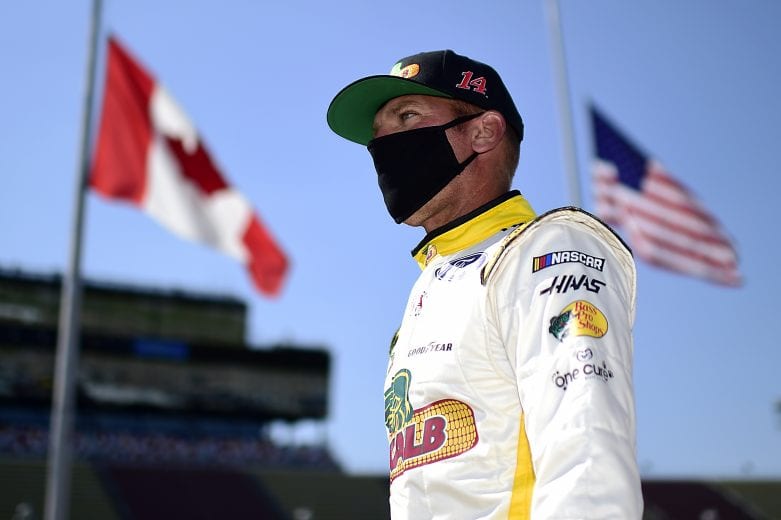 BROOKLYN, MICHIGAN - AUGUST 08: Clint Bowyer, driver of the #14 DEKALB Ford, walks the grid prior to the NASCAR Cup Series FireKeepers Casino 400 at Michigan International Speedway on August 08, 2020 in Brooklyn, Michigan. (Photo by Jared C. Tilton/Getty Images) | Getty Images