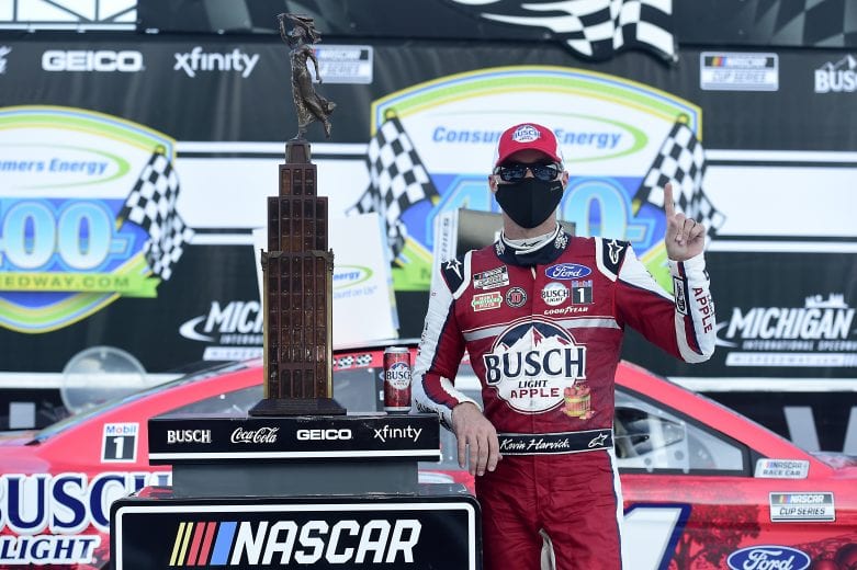 BROOKLYN, MICHIGAN - AUGUST 09: Kevin Harvick, driver of the #4 Busch Light Apple Ford, celebrates in Victory Lane after winning the NASCAR Cup Series Consumers Energy 400 at Michigan International Speedway on August 09, 2020 in Brooklyn, Michigan. (Photo by Jared C. Tilton/Getty Images) | Getty Images