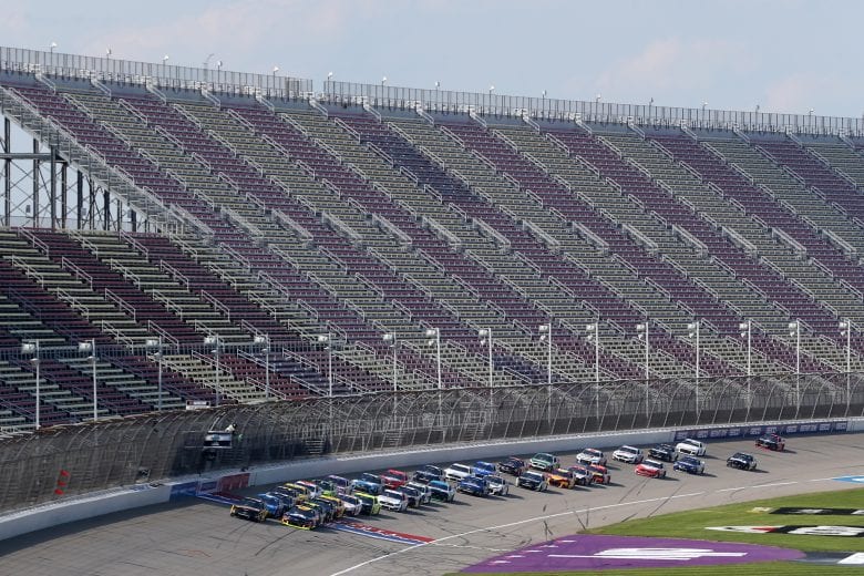 BROOKLYN, MICHIGAN - AUGUST 09: Clint Bowyer, driver of the #14 DEKALB Ford, and William Byron, driver of the #24 Axalta Chevrolet, lead the field to start the NASCAR Cup Series Consumers Energy 400 at Michigan International Speedway on August 09, 2020 in Brooklyn, Michigan. (Photo by Brian Lawdermilk/Getty Images) | Getty Images