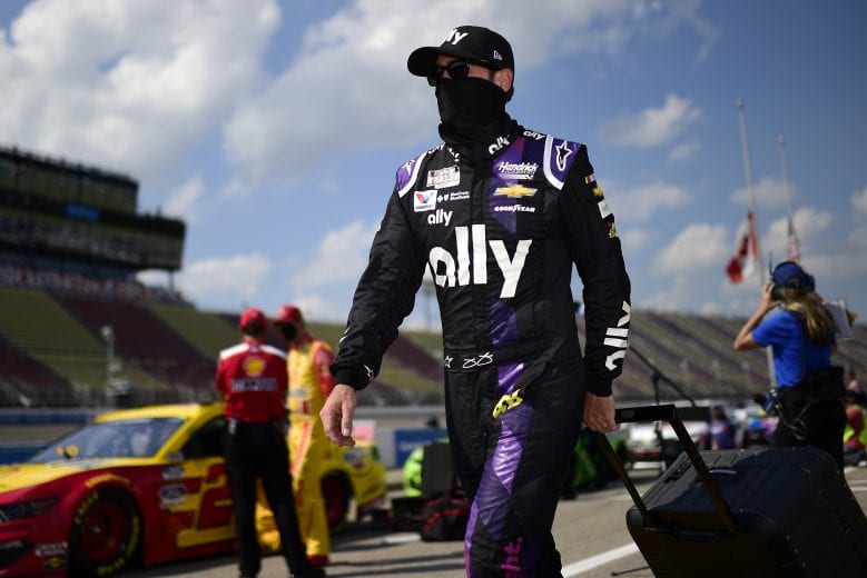 BROOKLYN, MICHIGAN - AUGUST 09: Jimmie Johnson, driver of the #48 Ally Fueling Futures Chevrolet, walks the grid prior to the NASCAR Cup Series Consumers Energy 400 at Michigan International Speedway on August 09, 2020 in Brooklyn, Michigan. (Photo by Jared C. Tilton/Getty Images) | Getty Images