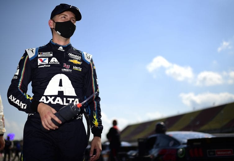BROOKLYN, MICHIGAN - AUGUST 09: William Byron, driver of the #24 Axalta Chevrolet, walks the grid prior to the NASCAR Cup Series Consumers Energy 400 at Michigan International Speedway on August 09, 2020 in Brooklyn, Michigan. (Photo by Jared C. Tilton/Getty Images) | Getty Images