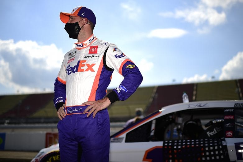 BROOKLYN, MICHIGAN - AUGUST 09: Denny Hamlin, driver of the #11 FedEx Ground Toyota, waits on the grid prior to the NASCAR Cup Series Consumers Energy 400 at Michigan International Speedway on August 09, 2020 in Brooklyn, Michigan. (Photo by Jared C. Tilton/Getty Images) | Getty Images
