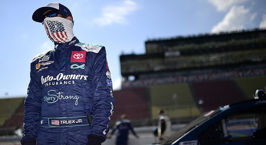 BROOKLYN, MICHIGAN - AUGUST 09: Martin Truex Jr., driver of the #19 Auto-Owner's Insurance Toyota, waits on the grid prior to the NASCAR Cup Series Consumers Energy 400 at Michigan International Speedway on August 09, 2020 in Brooklyn, Michigan. (Photo by Jared C. Tilton/Getty Images) | Getty Images