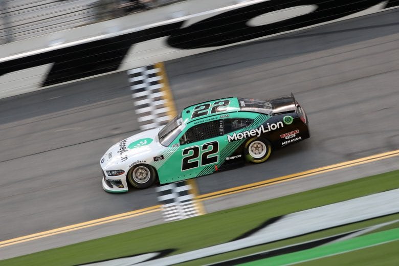 DAYTONA BEACH, FLORIDA - AUGUST 15: Austin Cindric, driver of the #22 MoneyLion Ford, crosses the finish line winning the NASCAR Xfinity Series UNOH 188 at Daytona International Speedway on August 15, 2020 in Daytona Beach, Florida. (Photo by Chris Graythen/Getty Images) | Getty Images