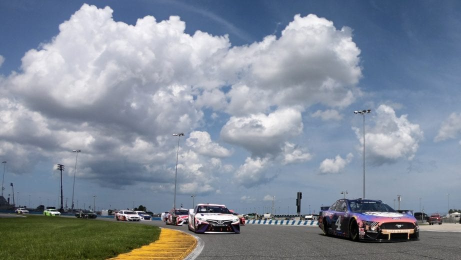 DAYTONA BEACH, FLORIDA - AUGUST 16: Kevin Harvick, driver of the #4 Busch Beer National Forest Foundation Ford, and Denny Hamlin, driver of the #11 FedEx Freight Toyota, lead the field on a pace lap prior to ASCAR Cup Series Go Bowling 235 at Daytona International Speedway on August 16, 2020 in Daytona Beach, Florida. (Photo by Chris Graythen/Getty Images) | Getty Images
