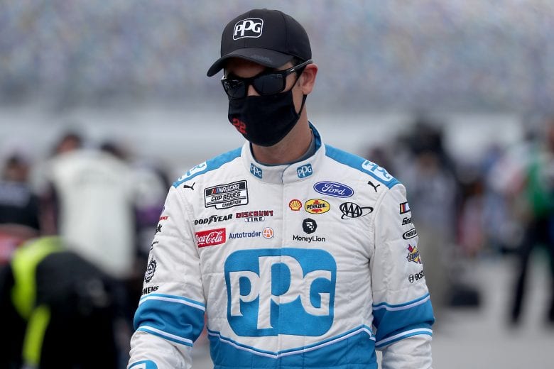 DAYTONA BEACH, FLORIDA - AUGUST 16: Joey Logano, driver of the #22 PPG Ford, walks the grid prior to the NASCAR Cup Series Go Bowling 235 at Daytona International Speedway on August 16, 2020 in Daytona Beach, Florida. (Photo by Chris Graythen/Getty Images) | Getty Images
