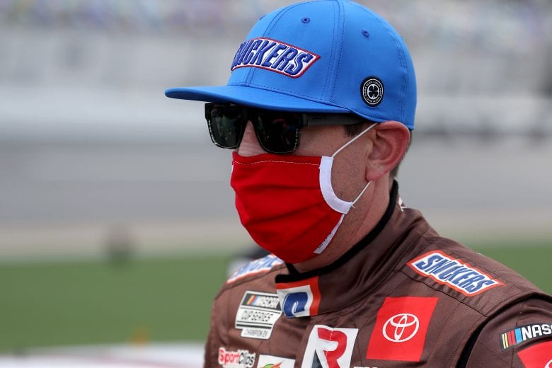 DAYTONA BEACH, FLORIDA - AUGUST 16: Kyle Busch, driver of the #18 Snickers Toyota, waits on the grid prior to the NASCAR Cup Series Go Bowling 235 at Daytona International Speedway on August 16, 2020 in Daytona Beach, Florida. (Photo by Chris Graythen/Getty Images) | Getty Images