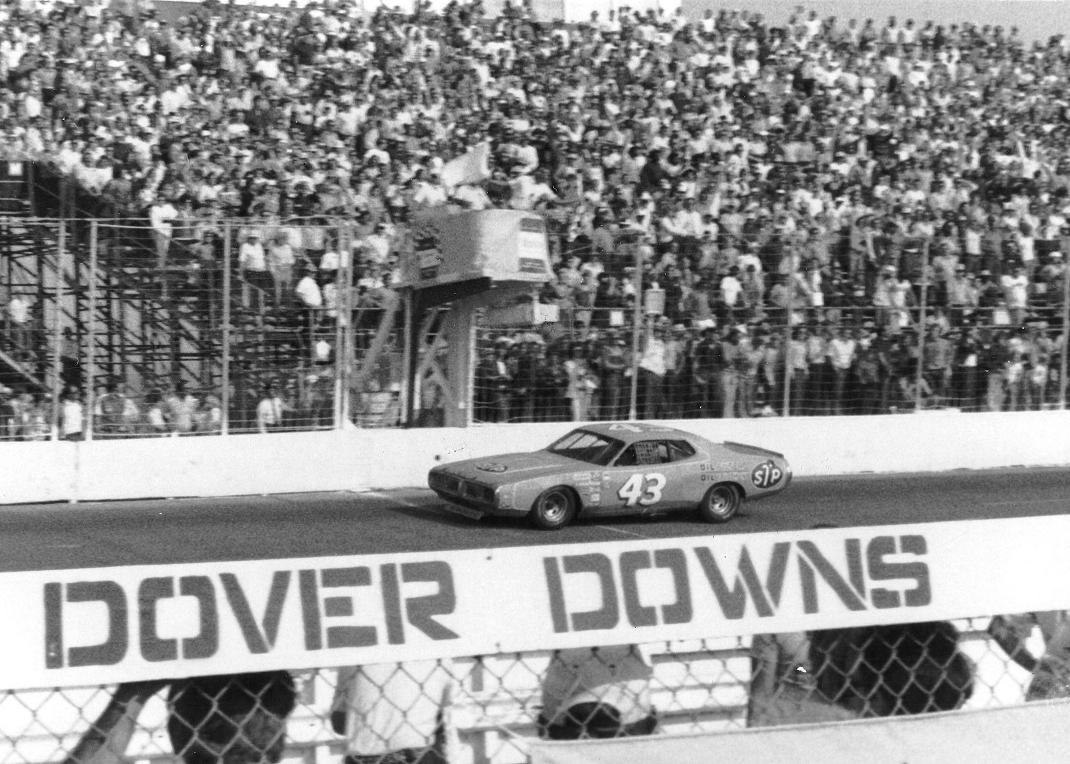 DOVER, DE Ð 1970s: Richard Petty gets the checkered flag as he takes a NASCAR Cup win at Dover Downs International Speedway in the mid-1970s. (Photo by ISC Images & Archives via Getty Images)