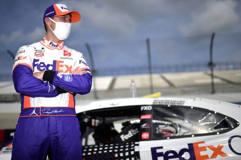 DOVER, DELAWARE - AUGUST 22: Denny Hamlin, driver of the #11 FedEx Office Toyota, waits on the grid prior to the NASCAR Cup Series Drydene 311 at Dover International Speedway on August 22, 2020 in Dover, Delaware. (Photo by Jared C. Tilton/Getty Images) | Getty Images