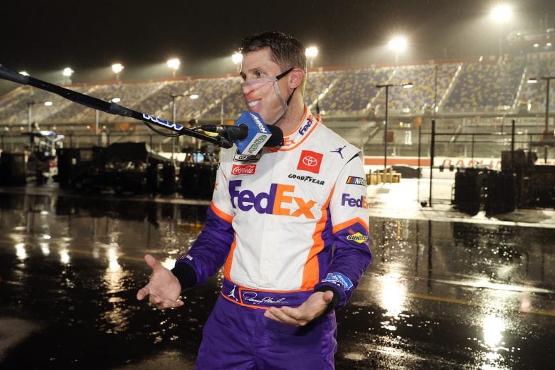 DARLINGTON, SOUTH CAROLINA - MAY 20: Denny Hamlin, driver of the #11 FedEx Delivering Strength Toyota, celebrates after winning the rain-shortened NASCAR Cup Series Toyota 500 at Darlington Raceway on May 20, 2020 in Darlington, South Carolina. (Photo by Chris Graythen/Getty Images) | Getty Images