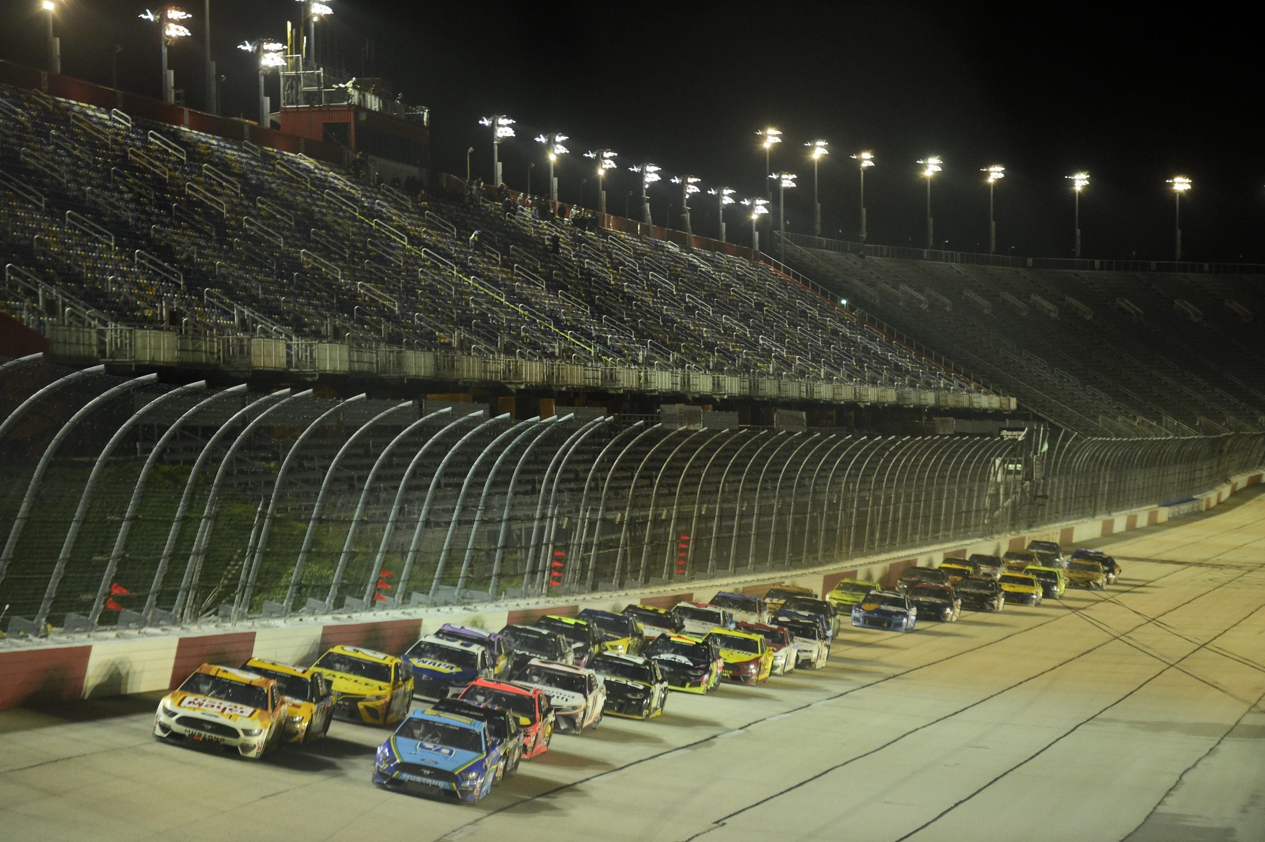 DARLINGTON, SOUTH CAROLINA - MAY 20: Chris Buescher, driver of the #17 Fifth Third Bank Ford, and Ryan Newman, driver of the #6 Oscar Mayer Hot Dogs Ford, lead a pack of cars during the NASCAR Cup Series Toyota 500 at Darlington Raceway on May 20, 2020 in Darlington, South Carolina. (Photo by Jared C. Tilton/Getty Images) | Getty Images