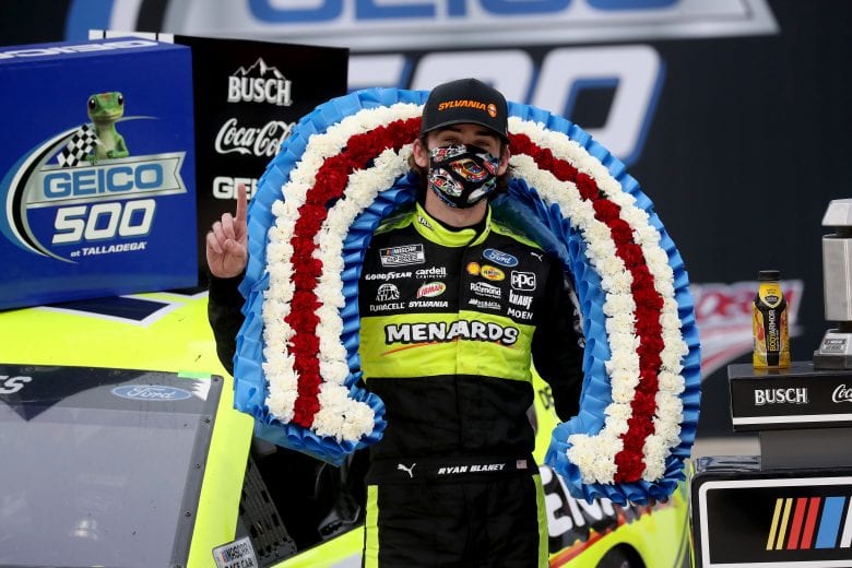 TALLADEGA, ALABAMA - JUNE 22:  Ryan Blaney, driver of the #12 Menards/Sylvania Ford, celebrates in Victory Lane after winning the NASCAR Cup Series GEICO 500 at Talladega Superspeedway on June 22, 2020 in Talladega, Alabama. (Photo by Chris Graythen/Getty Images) | Getty Images