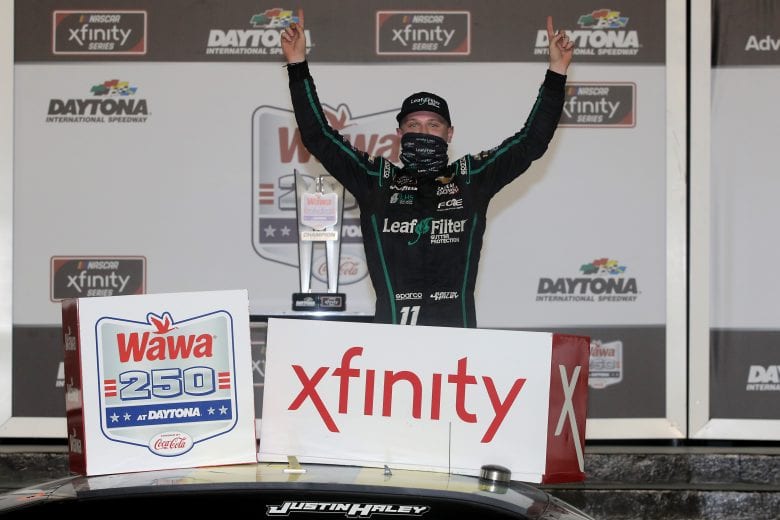 DAYTONA BEACH, FLORIDA - AUGUST 28: Justin Haley, driver of the #11 LeafFilter Gutter Protection Chevrolet, celebrates in Victory Lane after winning the NASCAR Xfinity Series Wawa 250 Powered by Coca-Cola at Daytona International Speedway on August 28, 2020 in Daytona Beach, Florida. (Photo by Chris Graythen/Getty Images) | Getty Images