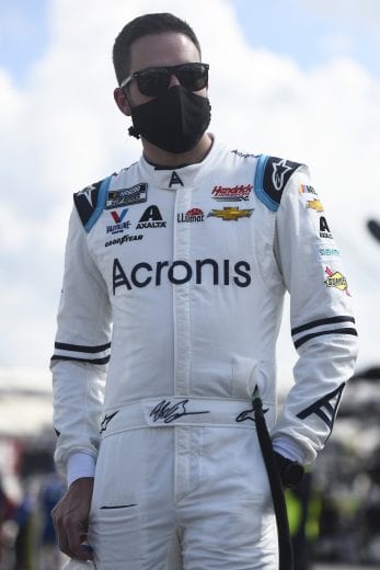 DOVER, DELAWARE - AUGUST 23: Alex Bowman, driver of the #88 Acronis Chevrolet, waits on the grid prior to the NASCAR Cup Series Drydene 311 at Dover International Speedway on August 23, 2020 in Dover, Delaware. (Photo by Jared C. Tilton/Getty Images) | Getty Images