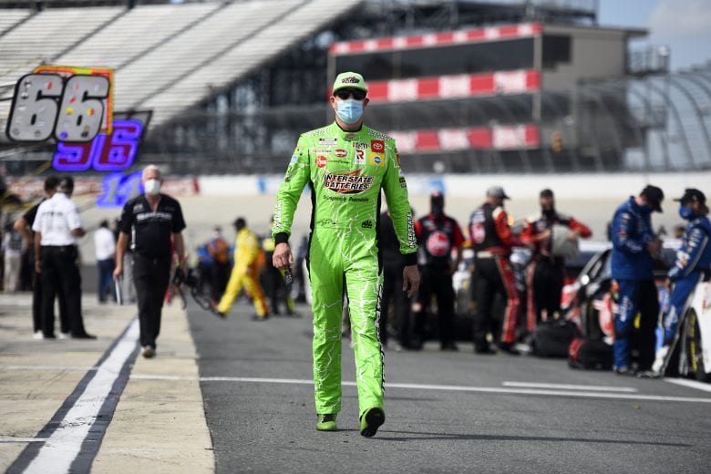DOVER, DELAWARE - AUGUST 22: Kyle Busch, driver of the #18 Interstate Batteries Toyota, walks the grid prior to  the NASCAR Cup Series Drydene 311 at Dover International Speedway on August 22, 2020 in Dover, Delaware. (Photo by Jared C. Tilton/Getty Images) | Getty Images