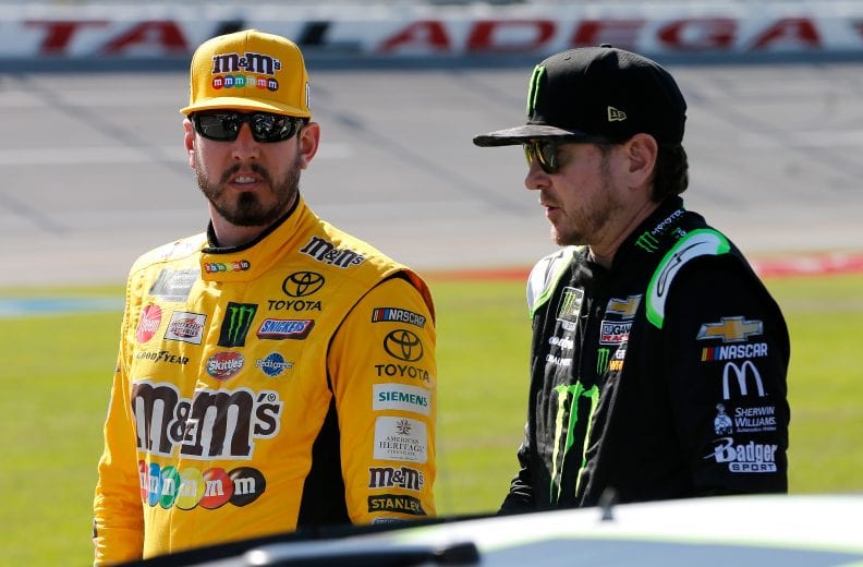 TALLADEGA, AL - APRIL 27: Kyle Busch, driver of the #18 M&M's Chocolate Bar Toyota, talks with his brother, Kurt Busch, driver of the #1 Monster Energy Chevrolet, during qualifying for the Monster Energy NASCAR Cup Series GEICO 500 at Talladega Superspeedway on April 27, 2019 in Talladega, Alabama. (Photo by Brian Lawdermilk/Getty Images) | Getty Images