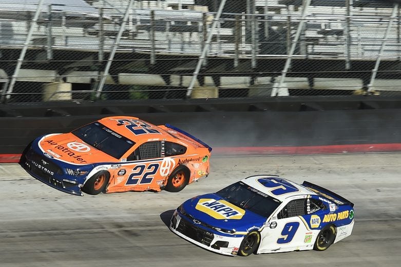 BRISTOL, TENNESSEE - MAY 31: Joey Logano, driver of the #22 Autotrader Ford,and Chase Elliott, driver of the #9 NAPA Auto Parts Chevrolet, crash during the NASCAR Cup Series Food City presents the Supermarket Heroes 500 at Bristol Motor Speedway on May 31, 2020 in Bristol, Tennessee. (Photo by Jared C. Tilton/Getty Images) | Getty Images