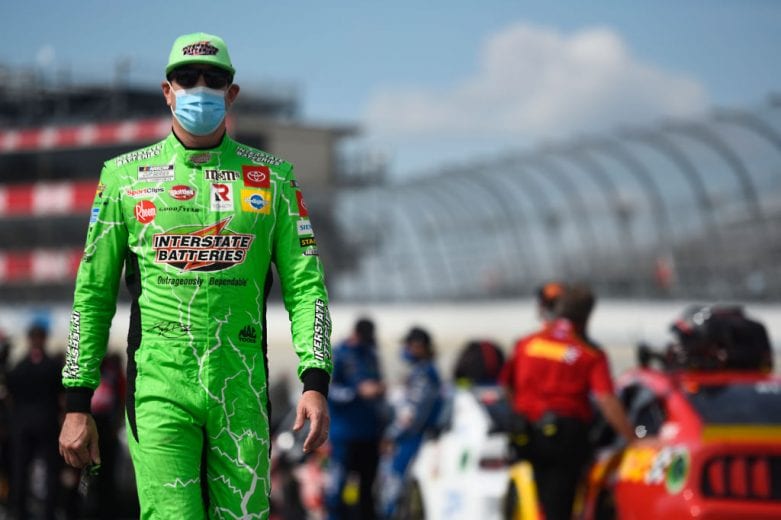 DOVER, DELAWARE - AUGUST 22: Kyle Busch, driver of the #18 Interstate Batteries Toyota, walks the grid prior to the NASCAR Cup Series Drydene 311 at Dover International Speedway on August 22, 2020 in Dover, Delaware. (Photo by Jared C. Tilton/Getty Images) | Getty Images