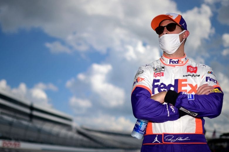 DOVER, DELAWARE - AUGUST 23: Denny Hamlin, driver of the #11 FedEx Office Toyota, waits on the grid prior to the NASCAR Cup Series Drydene 311 at Dover International Speedway on August 23, 2020 in Dover, Delaware. (Photo by Jared C. Tilton/Getty Images) | Getty Images