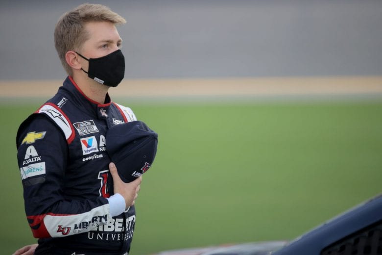 DAYTONA BEACH, FLORIDA - AUGUST 29: William Byron, driver of the #24 Liberty University Chevrolet, stands on the grid prior to the NASCAR Cup Series Coke Zero Sugar 400 at Daytona International Speedway on August 29, 2020 in Daytona Beach, Florida. (Photo by Chris Graythen/Getty Images) | Getty Images