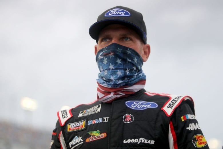 DAYTONA BEACH, FLORIDA - AUGUST 29: Clint Bowyer, driver of the #14 Haas Automation Ford, walks on the grid prior to the NASCAR Cup Series Coke Zero Sugar 400 at Daytona International Speedway on August 29, 2020 in Daytona Beach, Florida. (Photo by Chris Graythen/Getty Images) | Getty Images